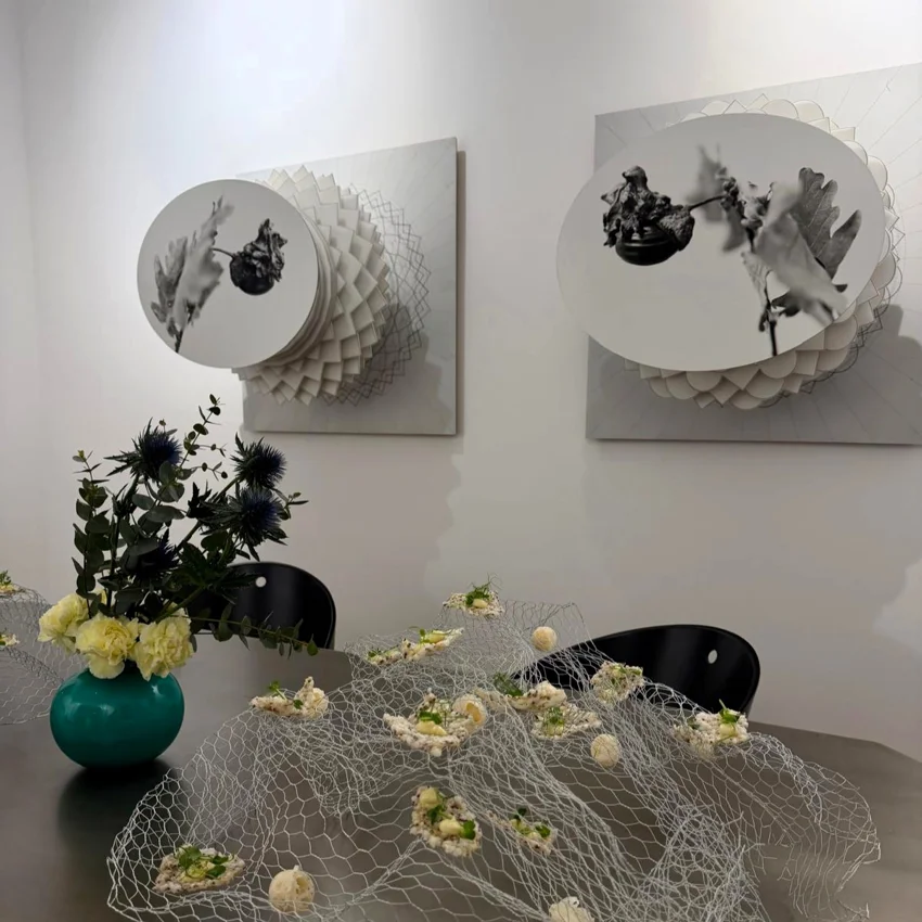 Table setup featuring artistic food arrangements and floral decoration at a Quintet Group event in Milan.