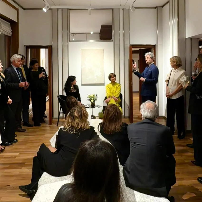 Audience gathered during a Quintet Group event in Milan, with a speaker addressing attendees in an indoor setting.